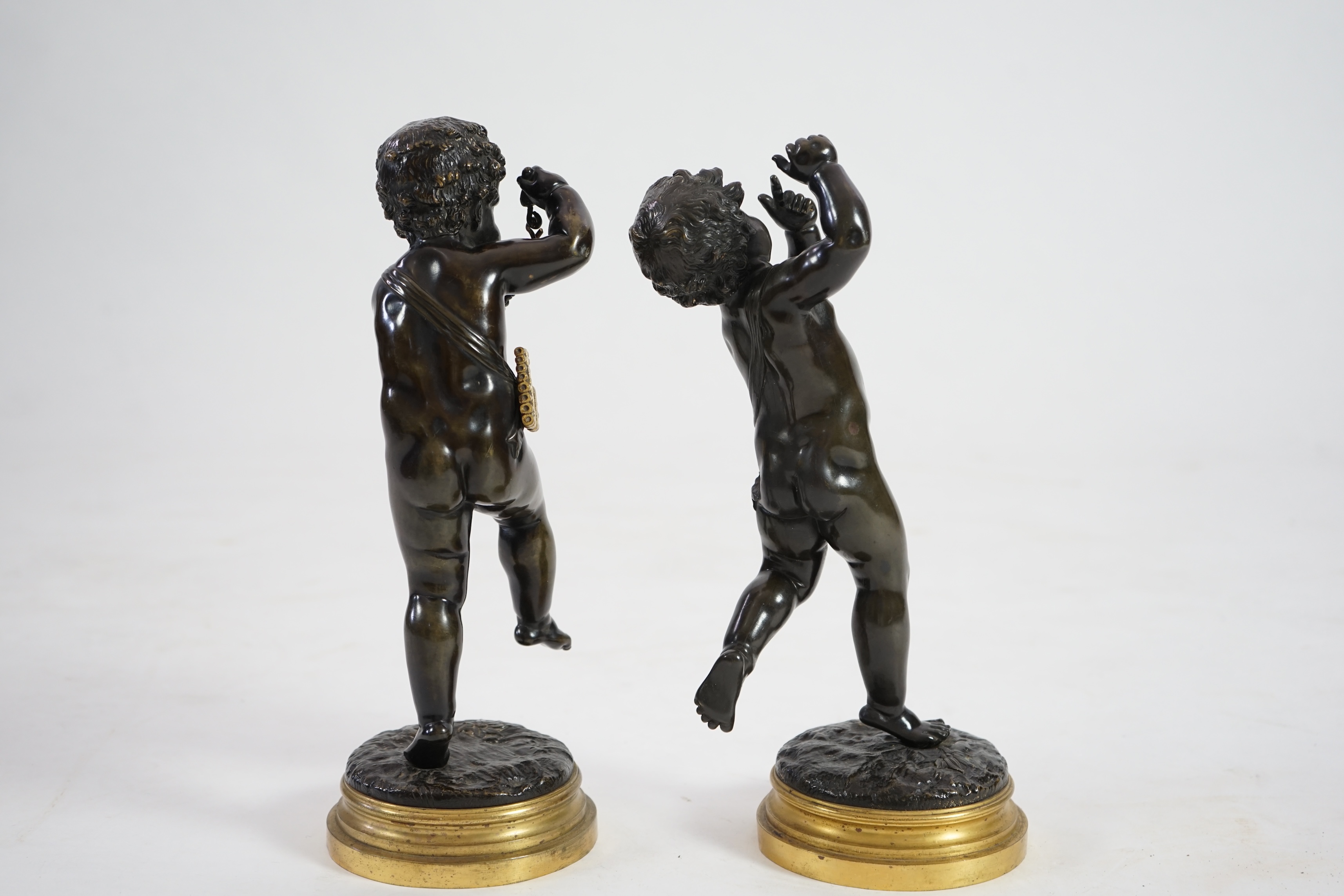 After Claude Michel Clodion (French, 1738-1814), a pair of late 19th century bronze figures of musical putti